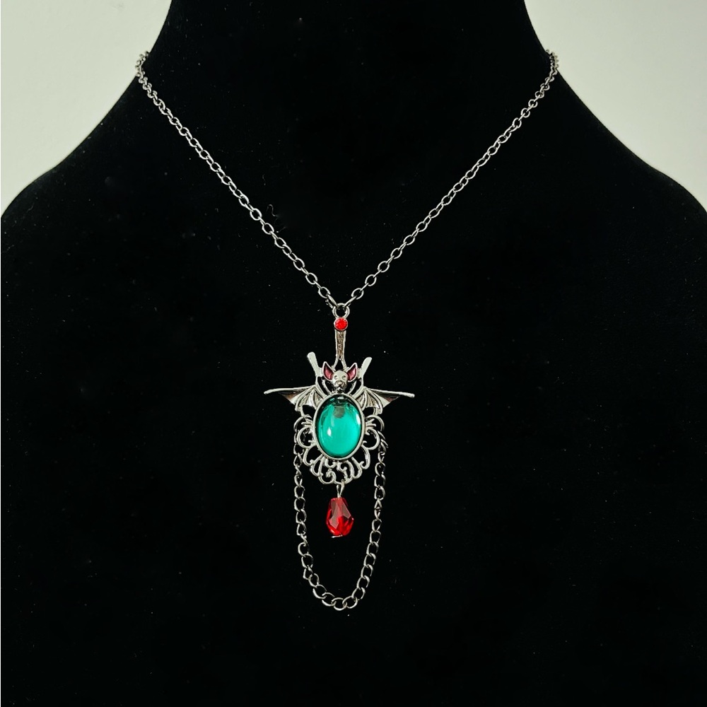 Hand Crafted Bat Necklace with Green and Red Accents